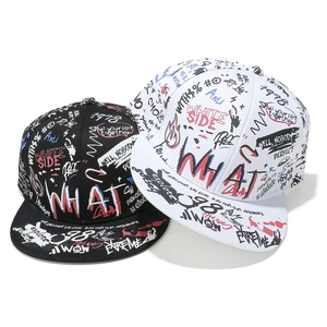 Close-up of black and white snapback hats with colorful all-over street graffiti patterns