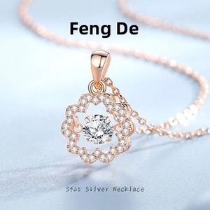 Macro shot of S925 silver flower pendant with rose gold finish and sparkling moissanite