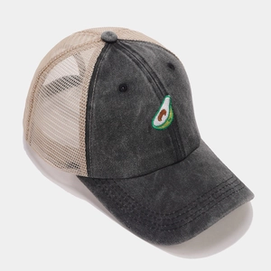 Close-up of avocado embroidery and breathable mesh stitching on baseball cap
