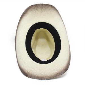 Detail view of woven straw sun hat interior with sweatband and 100% paper material label