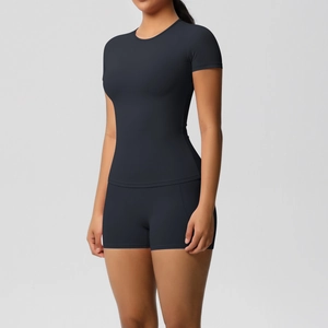 Close-up of black breathable yoga set showing matte brushed fabric texture and slim fit