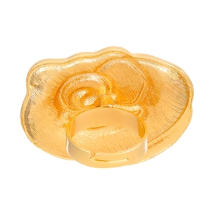 Detail of golden adjustable ring featuring a bold abstract flower with radial textures