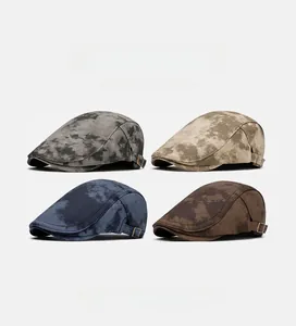 Detailed view of four colorful British style flat caps with side metal buckle adjustments
