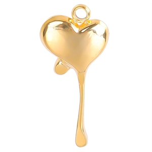 Polished gold dripping heart pendant made of stainless steel on a white background