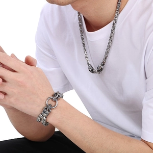 Punk style silver stainless steel skull necklace and matching chain bracelet for men