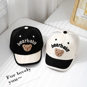 Detail of two mesh baby baseball caps with bear embroidery and breathable fabric