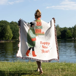 Detail of bohemian knit throw blanket with fringe edges and Happy New Year illustration