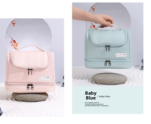 Dual-layer travel toiletry bag in pink and light blue with a sturdy top handle