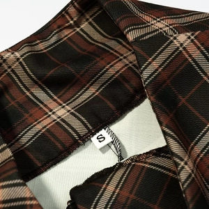 Chic asymmetrical plaid skirt in brown and beige with a close-up on size S label