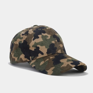 Detail of camouflage corduroy baseball cap showing fabric texture and curved brim