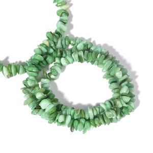 Macro shot of irregular green shell stone beads for DIY jewelry making and necklace crafts