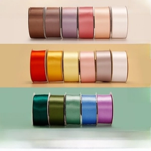 Polished high-density green satin ribbons in various colors for elegant gift packaging