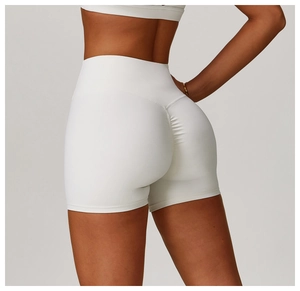 Close-up of high-waist yoga shorts showing the scrunch butt lifting seam and white fabric