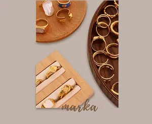 Detailed close-up of retro 18K gold plated titanium rings with zircon and daisy inlay