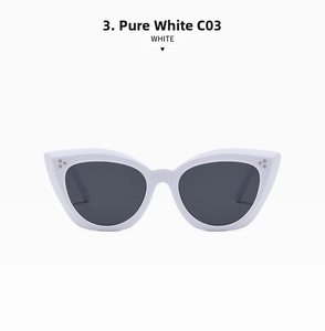 Detail view of solid white cat eye sunglasses with gray lenses and metal dot accents