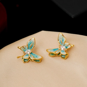 Elegant gold butterfly earrings with blue-green enamel and white zircon accents