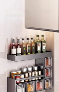 Macro view of wall-mounted kitchen spice rack with dual tiers and drawer storage