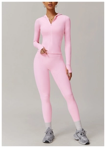 Pink zip-up yoga set detail with hooded jacket, thumbhole cuffs and high waist leggings