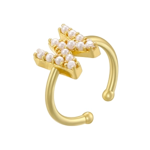 Detailed close-up of a gold-plated letter M ring adorned with small white pearls