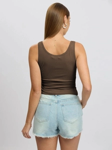 Back view of brown ribbed U-neck tank top paired with light blue denim shorts