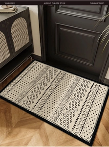 Macro detail of French retro doormat featuring black geometric patterns and edge stitching