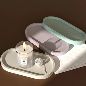 Détail des moules en silicone ovales aux tons mats vert menthe, lavande et crème