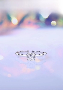 Close-up of S925 silver bamboo-style ring with cushion-cut stone and four-prong setting