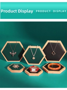 Detail of hexagonal wooden jewelry display set with velvet lining for necklace and watch