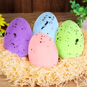 Close-up of colorful speckled Easter eggs in a decorative nest on a rustic wooden table