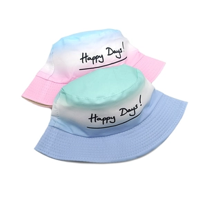Tie-dye gradient bucket hats for kids with Happy Days print on a soft cotton fabric