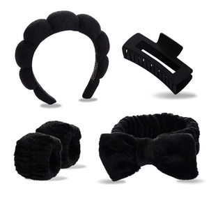 Detail view of 4-piece black plush headband set with sponge band and wristbands