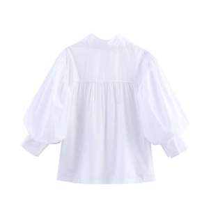 Back view of a crisp white poplin shirt featuring pleated back and elegant puff sleeves