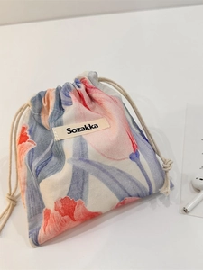 Floral drawstring organizer bag with pink tulip pattern on white cotton canvas fabric