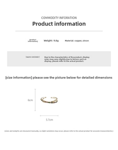 Detail view of colorful zircon crisscross bangle with dimensions 6cm x 5.7cm and 9.8g weight