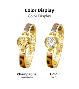 Detail of Bee Sister quartz watches with gold metal straps and tortoiseshell resin inlays