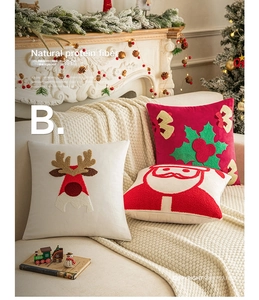 Détail de housses de coussin de Noël avec broderie Père Noël en fibre protéique naturelle