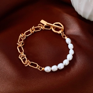 Detail of 18k gold plated paperclip chain and baroque pearls with OT toggle clasp
