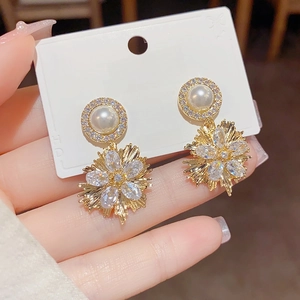 Detail of fireworks drop earrings with white pearls and S925 silver needle posts