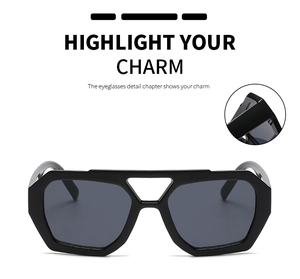 Detail of reinforced hinges on black hexagonal sunglasses with double bridge frames