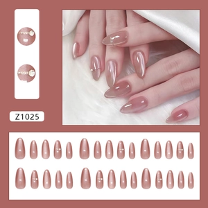 Dusty pink cat eye press-on nails with pearls and rhinestones, almond shape long design