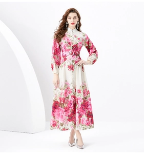 Detailed view of the realistic pink peony floral print on a white maxi dress fabric