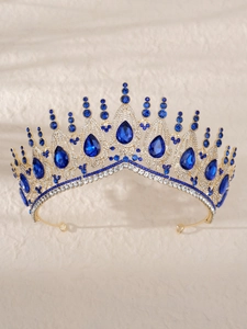 Close-up of golden baroque bridal crown featuring blue gems and luxury crystal rhinestones