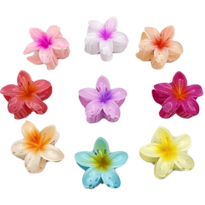 Frangipani plumeria flower hair claws in nine vibrant colors for resort styling