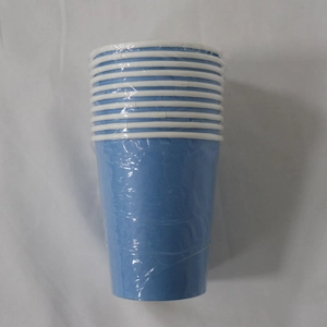 Close-up of stacked blue disposable paper cups wrapped in protective clear plastic film