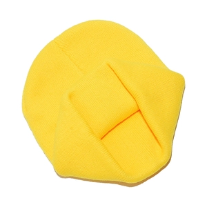Detailed close-up of yellow ribbed knit beanie featuring thick vertical texture