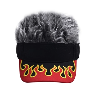 Detail of wig visor hat with grey synthetic hair and yellow flame embroidery on red brim