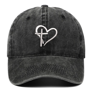 Close-up of heart and cross embroidery on vintage washed cotton baseball cap
