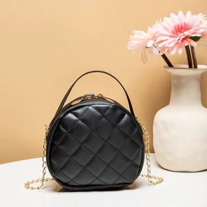 Chic black round crossbody bag with quilted rhombic pattern and gold chain strap