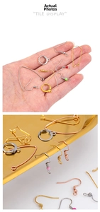 Macro display of assorted gold and silver stainless steel earring hooks for DIY jewelry