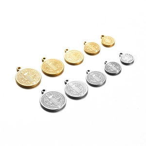 Round Saint Benedict medal pendants in gold and silver, showing five different sizes